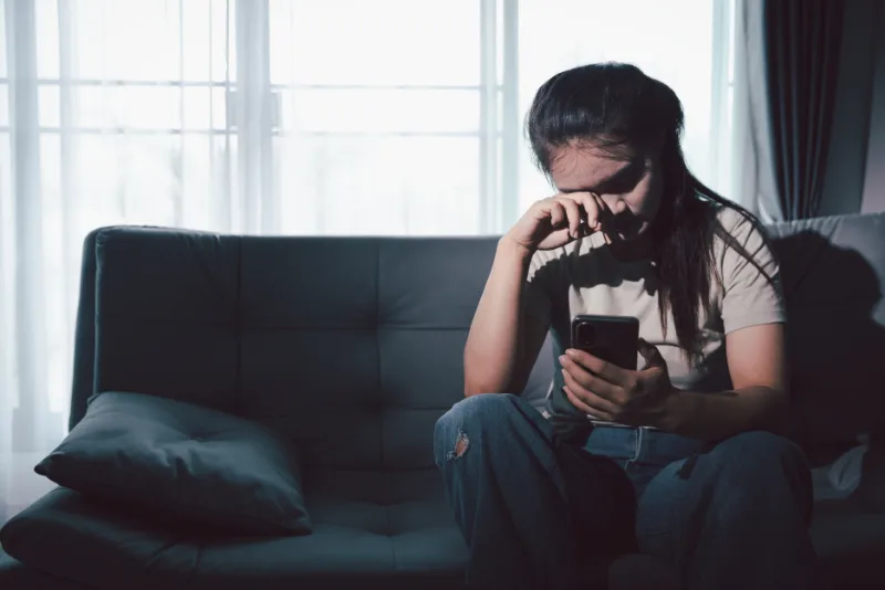 Woman using phone for people tracing investigation